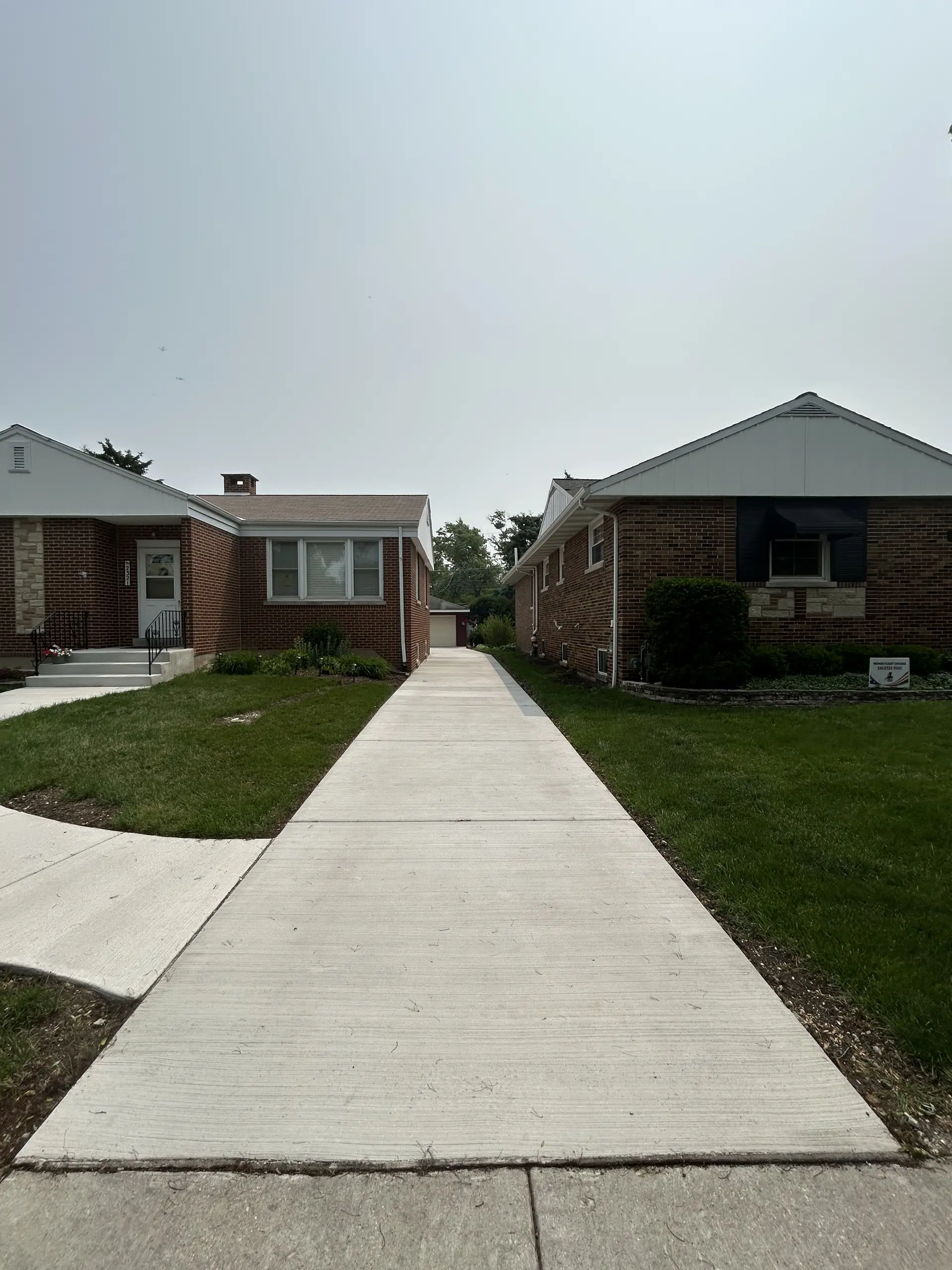 Wide residential concrete driveway installation near Chicago