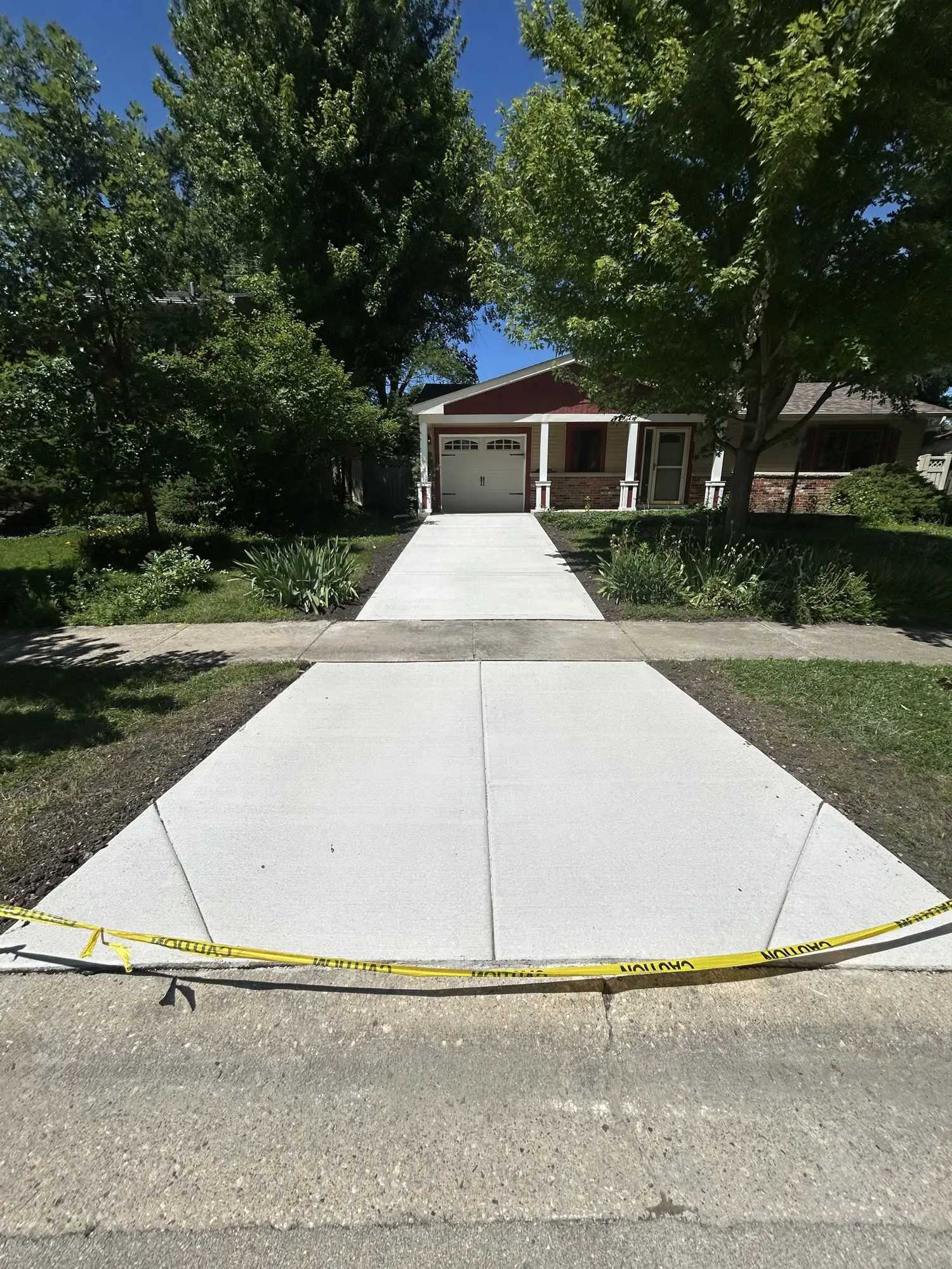 Concrete driveway and street apron replacement by FPI Construction