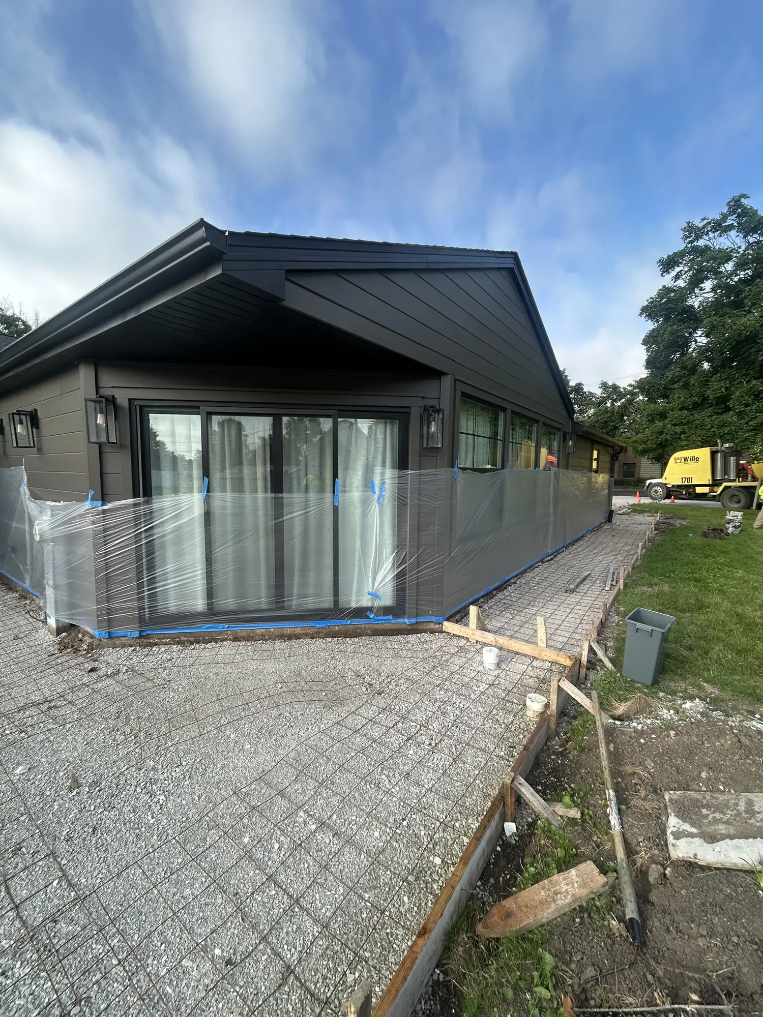 Wire mesh reinforcement and gravel base set for a concrete patio pour near Chicago